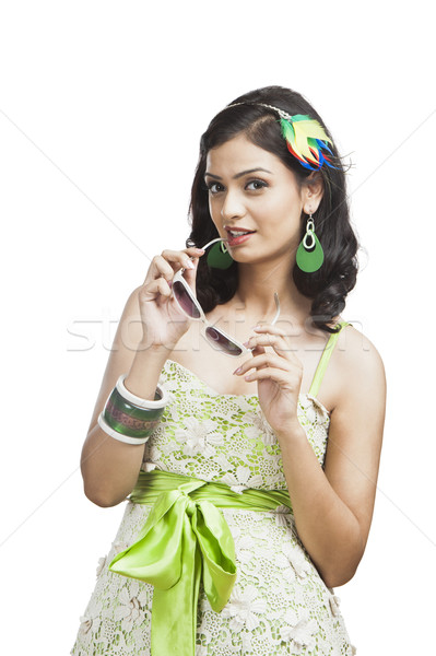 Beautiful young woman posing with sunglasses Stock photo © imagedb