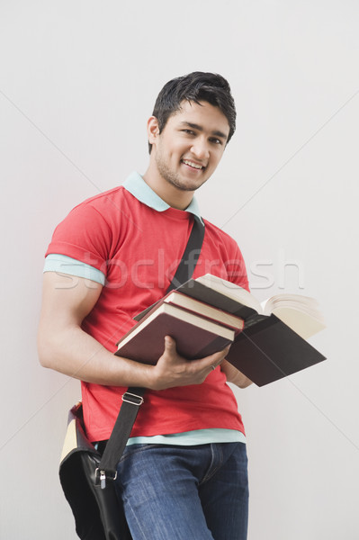 Portré férfi tart könyvek mosolyog oktatás Stock fotó © imagedb