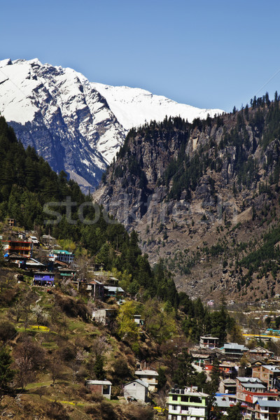 Town with snow covered mountains in the background, Manali, Hima Stock photo © imagedb