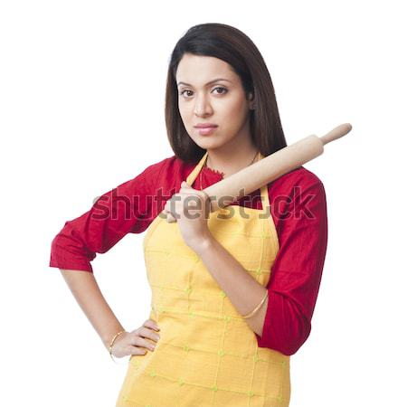 Portrait of a woman holding a rolling pin Stock photo © imagedb