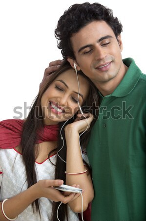 Woman giving a gift to her husband Stock photo © imagedb