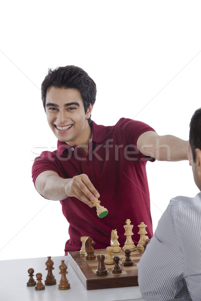 Man celebrating his success after winning chess game Stock photo © imagedb
