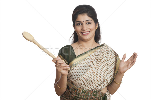 Portrait of a woman holding Wooden ladle Stock photo © imagedb