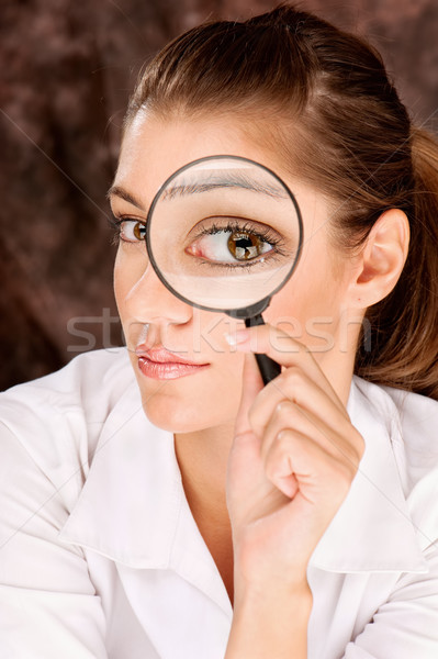 researcher looking through magnifier glass Stock photo © imarin