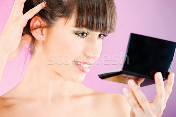 Femme visage peau miroir jolie femme regarder [[stock_photo]] © imarin