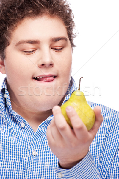 Stock photo: chubby man holding pear