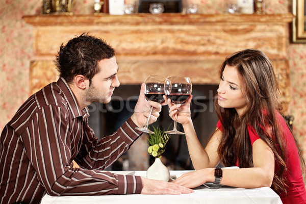 Couple cheers with wine Stock photo © imarin