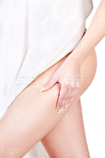 Woman pinching leg for skin fold test, isolated on white Stock photo © imarin