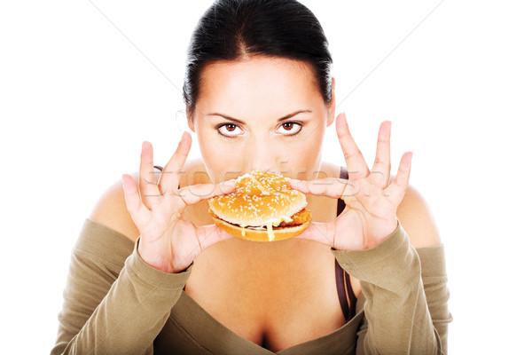 Dolofan fată fast food drăguţ mananca hamburger Imagine de stoc © imarin