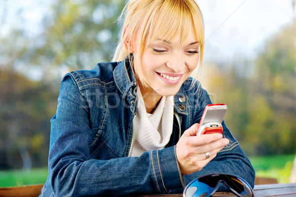 woman at park taking a phone call Stock photo © imarin