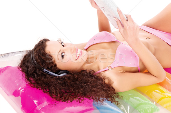 Lány levegő matrac olvas újság haj Stock fotó © imarin