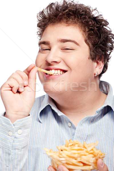豐滿的 男子 食品 快樂 年輕 炸薯條 商業照片 © imarin