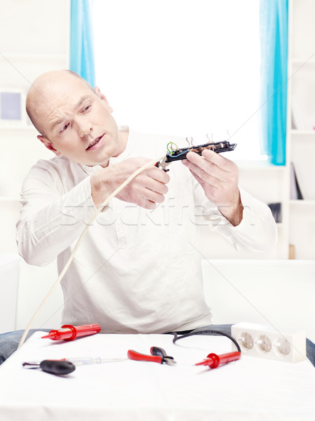 man doing minor repair at home Stock photo © imarin