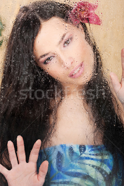Nő mögött üveg tele vízcseppek csinos nő Stock fotó © imarin
