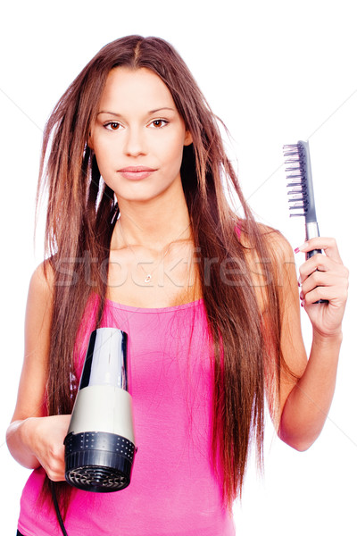 woman with long hair holding blow dryer and comb Stock photo © imarin