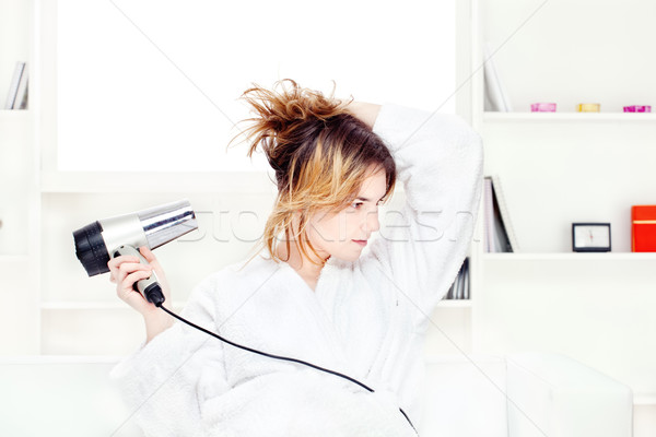 girl drying her hair at home Stock photo © imarin