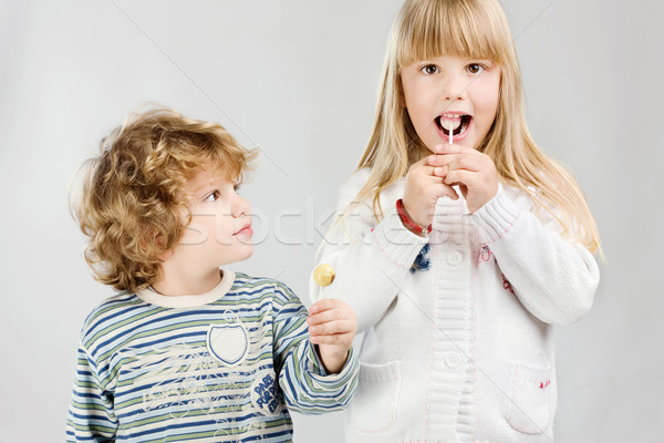 Enfants lollipop garçon fille sourire Kid Photo stock © imarin