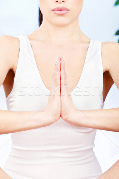Woman's hand in a spritual position Stock photo © imarin