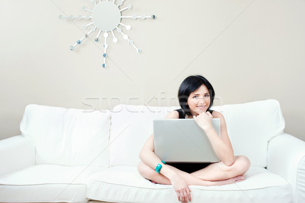 Menina branco sofá laptop bastante casa Foto stock © imarin