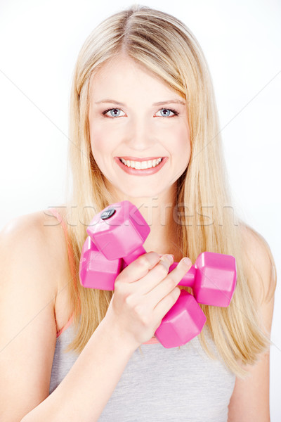 Stock photo: smiled woman holding two weights