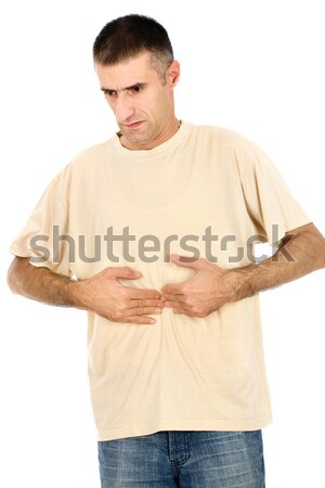 Kisajtolás gyomor fiatalember izolált fehér férfi Stock fotó © imarin