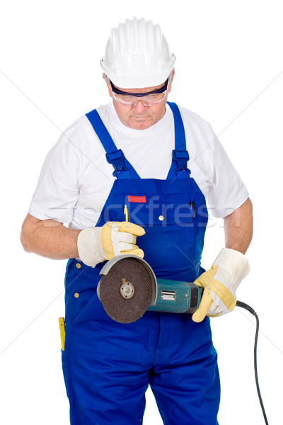 Middle age man in worker suite holding surface grinding machine Stock photo © imarin