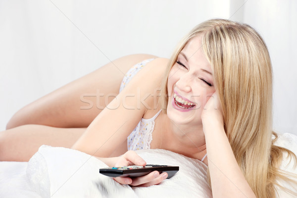 Foto stock: Sorrindo · cama · mulher · risonho · remoto