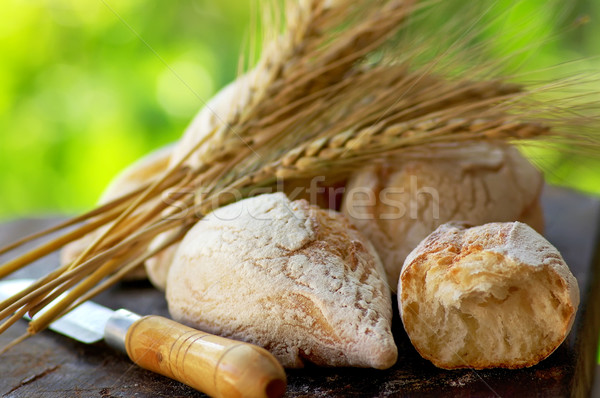 Portuguese bread and spikes of wheat. Stock photo © inaquim