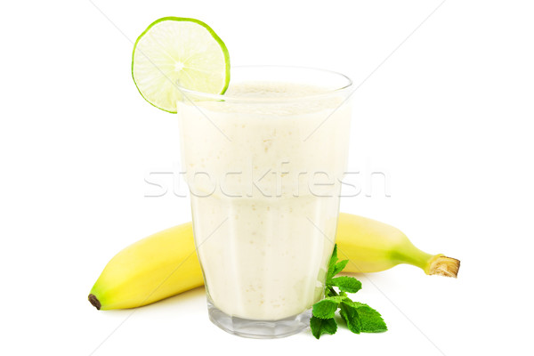Banana milkshake on white Stock photo © IngaNielsen