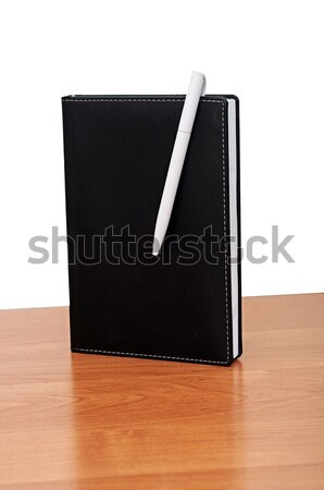 Stock photo: Black notepad and pen on table