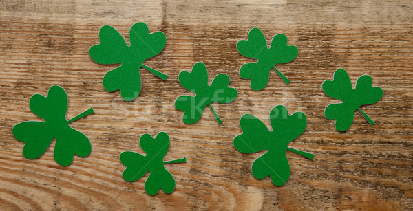 Green clovers or shamrocks on rustic wood background Stock photo © inxti