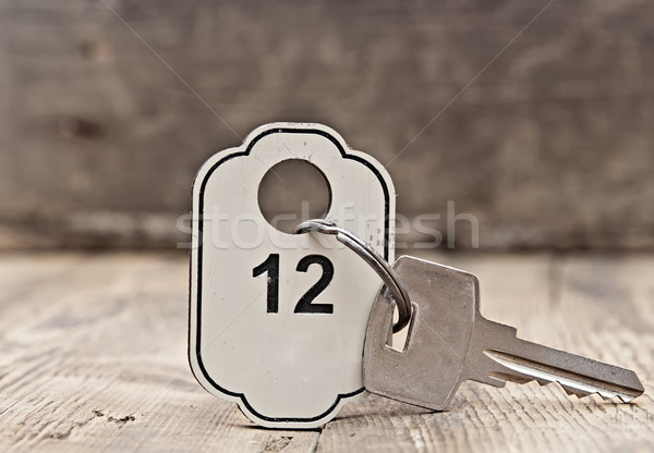 Hotel suite key with room number 12 on wood table  Stock photo © inxti