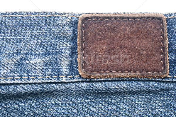 Leather jeans label sewed on jeans.  Stock photo © inxti
