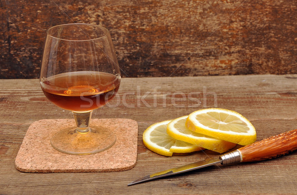 classic cognac with lemon and knife Stock photo © inxti