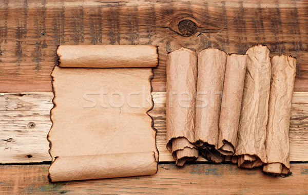 blank old sheet paper with pile scrolls on old wooden background Stock photo © inxti
