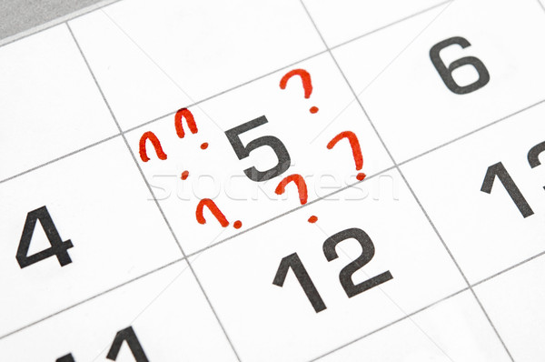 Stock photo: question marks on the calendar at 5. 