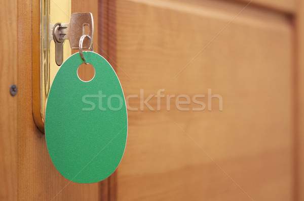 Stock photo: key in keyhole with blank label
