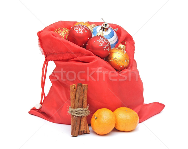 chrismas sack with balls, tangerine and cinnamon on white backgr Stock photo © inxti