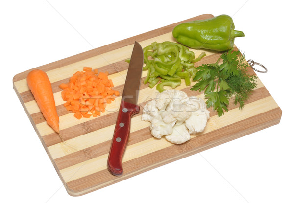 Still life of vegetables and kitchen-knife on cutting board Stock photo © inxti