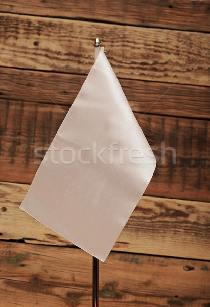 blank white flag over wooden wall. Put your own text Stock photo © inxti