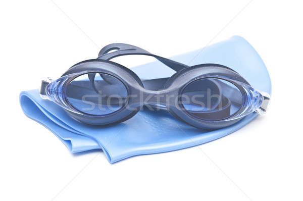 Blue swimming cap and goggles isolated on white  Stock photo © inxti