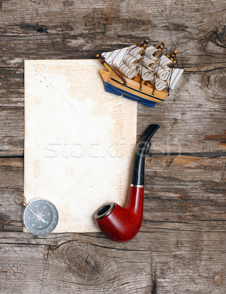 pipe, old paper, compass and model classic boat on wood backgrou Stock photo © inxti