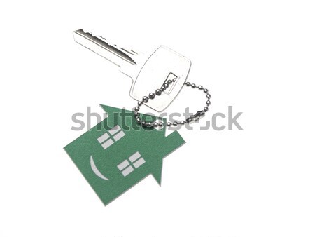 Stock photo: silver keys with house figure on the white background 