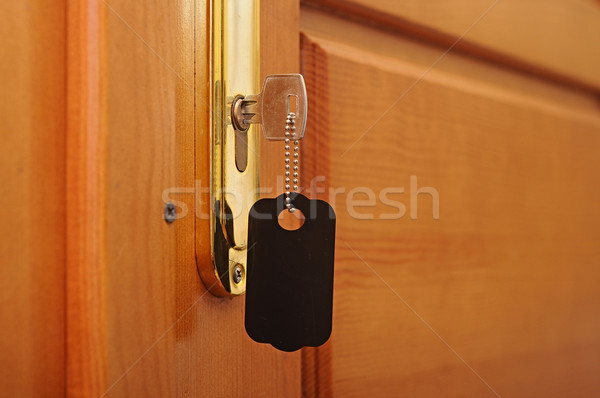 key in keyhole with blank label Stock photo © inxti
