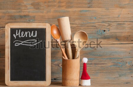 blank blackboard on wooden surface and wooden utensils Stock photo © inxti