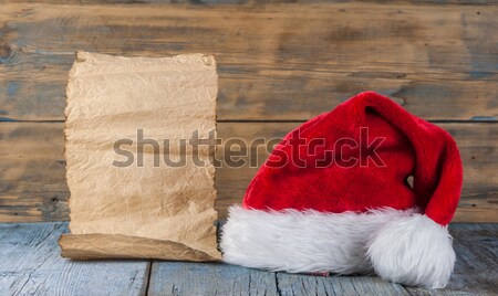 Santa cap on grunge blank sheet of paper  Stock photo © inxti