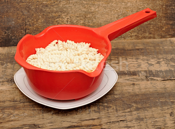 Pasta in red colander on table  Stock photo © inxti