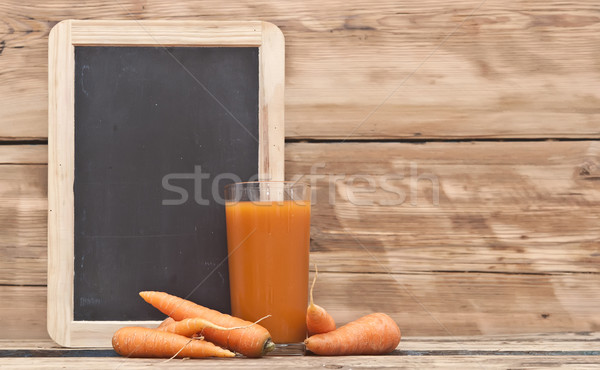 Healthy food - carrots and carrots juice with blank blackboard f Stock photo © inxti