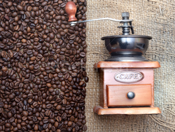 Coffee grinder on coffee grains close up Stock photo © inxti