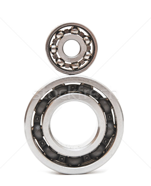 Big and small ball bearings on white background Stock photo © inxti